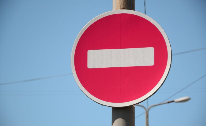 Road sign in the form of a white rectangle in a red circle